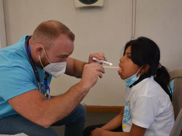 a doctor checking a patient's blood pressure